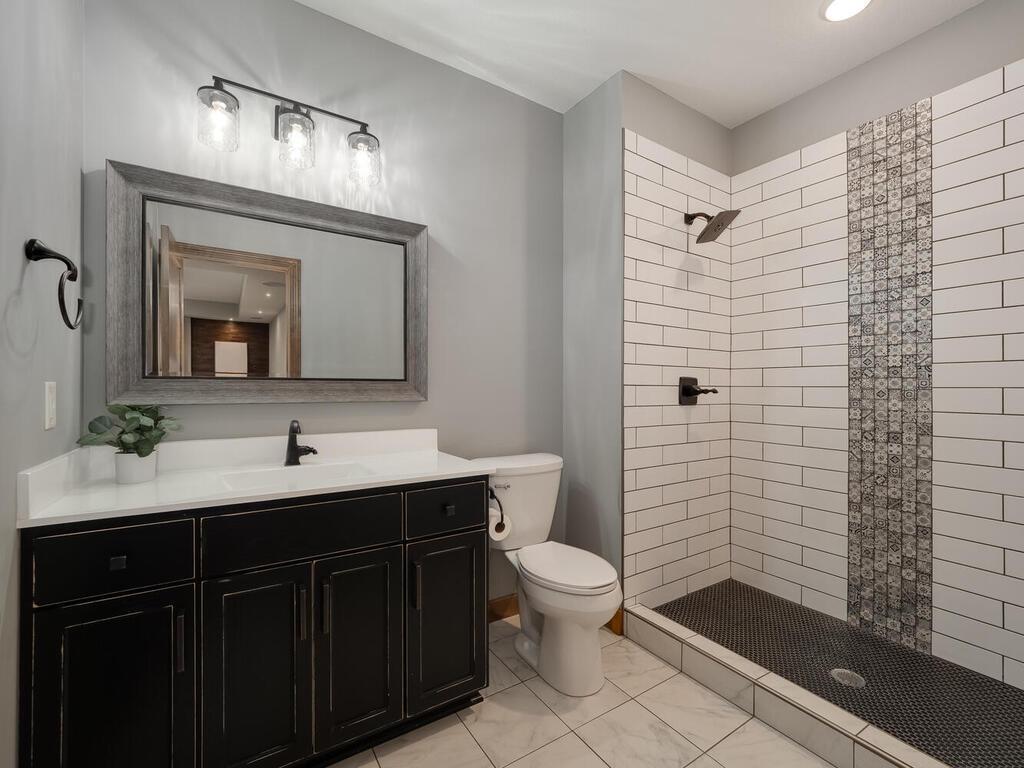 Lower level bathroom - stunning tile work!