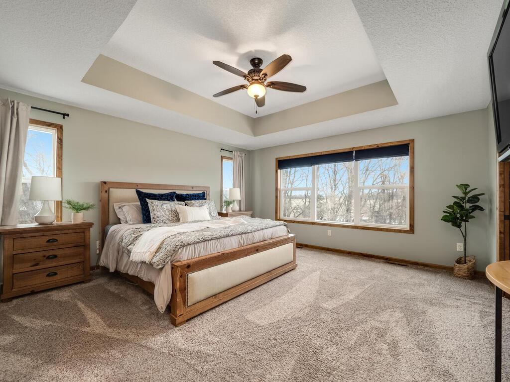 Luxurious primary suite - tray vault ceiling, huge windows