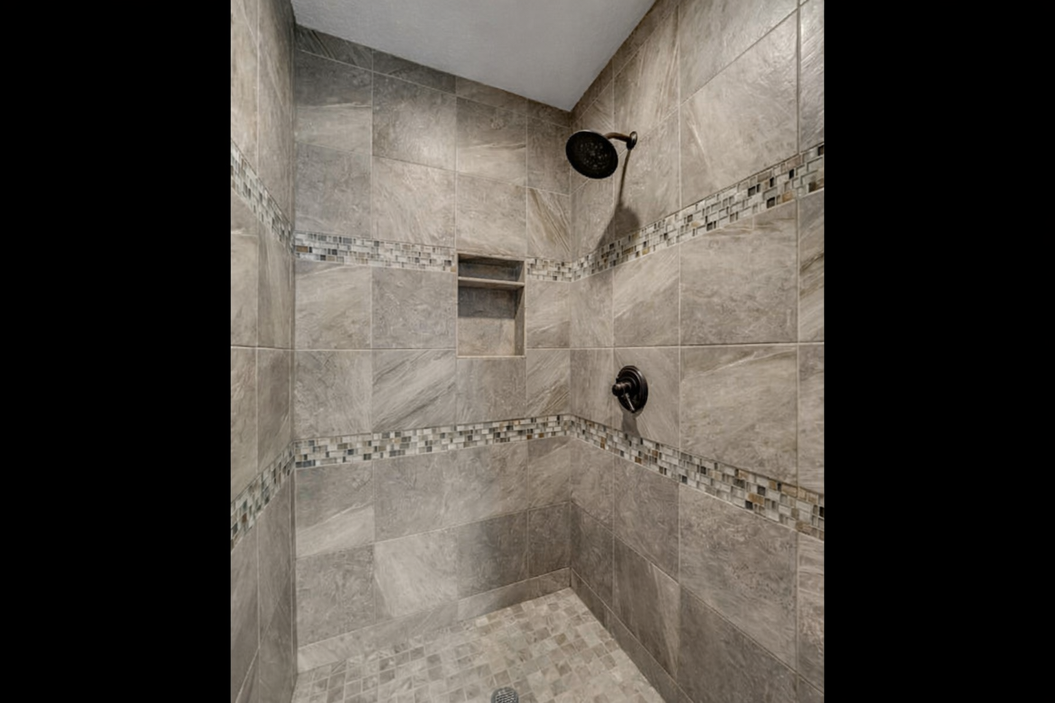 Tile walk-in shower w/ decorative niche