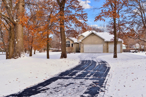 A long, private driveway leads you home, surrounded by mature trees and peaceful space to unwind.