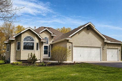 Arrive to a home that offers space for everything—plus the convenience of a three-stall garage.