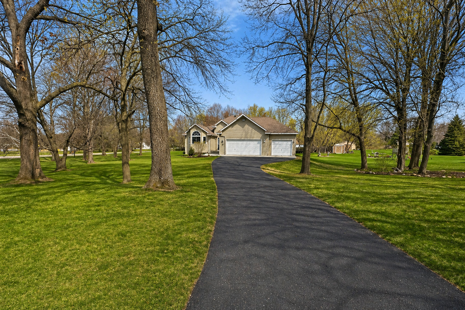 A long, private driveway leads you home, surrounded by mature trees and peaceful space to unwind.