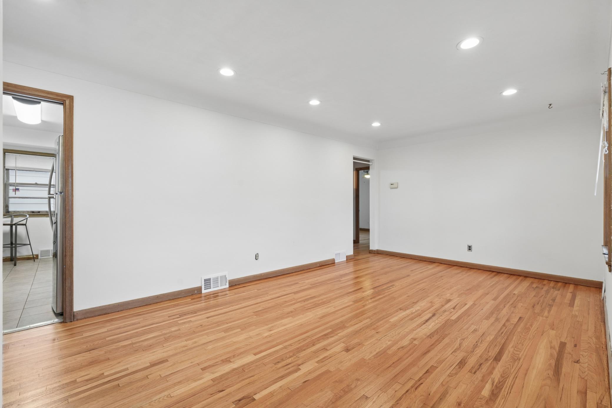 Beautifully refinished hardwood floors extend throughout the entire main level and the entire home was just painted.