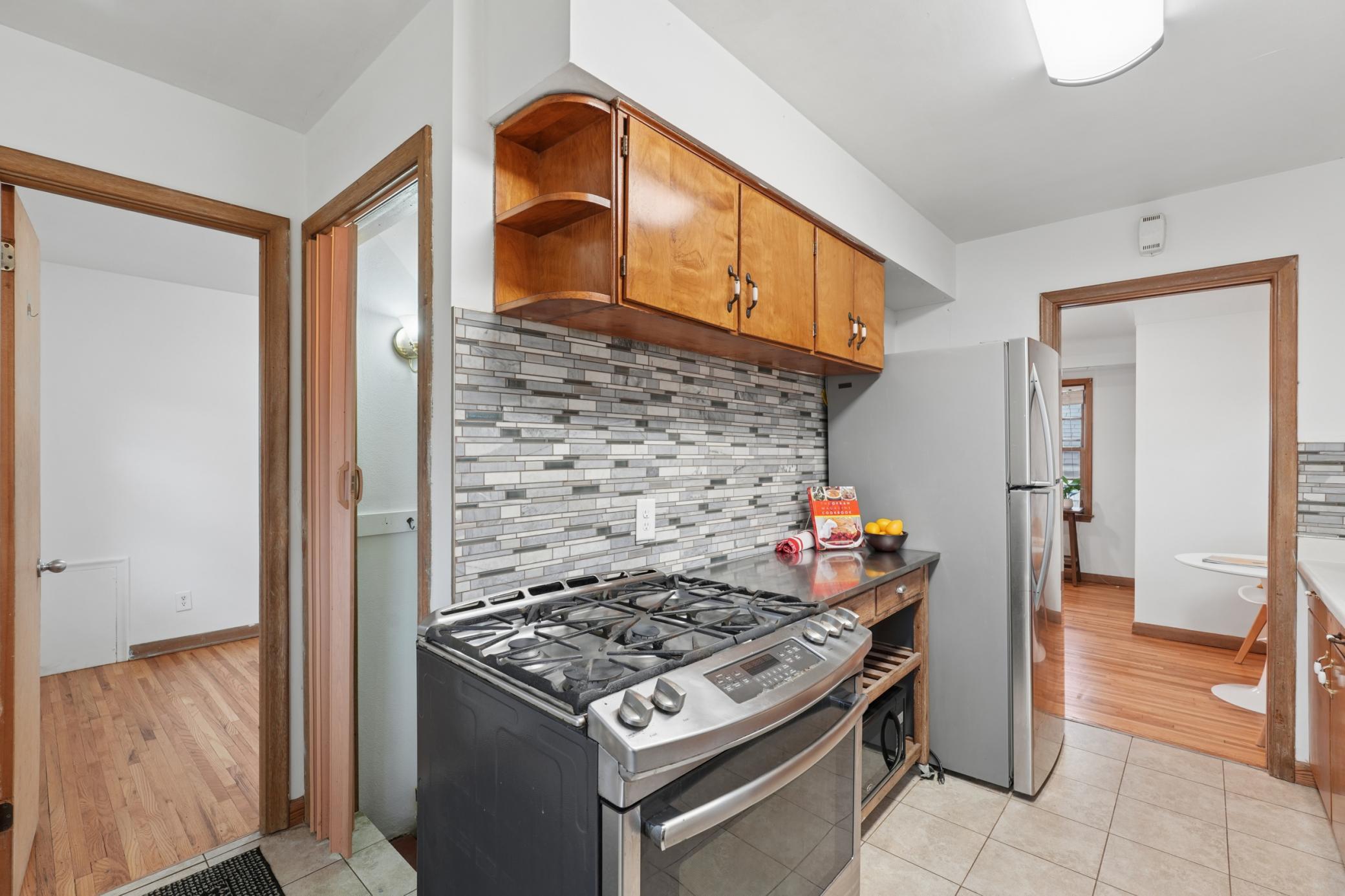 Stainless steel appliances and ample counter and storage space