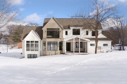 This 5,417 sq ft contemporary masterpiece beautifully blends sophistication with natural surroundings.