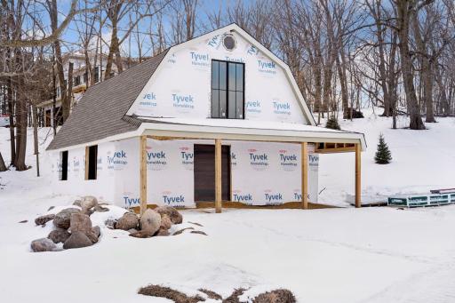 Two versatile outbuildings: This barn (28x36 with 18x36 loft) complete with new concrete floor, new marvin windows, new entry doors, new roof, soffit, and siding.