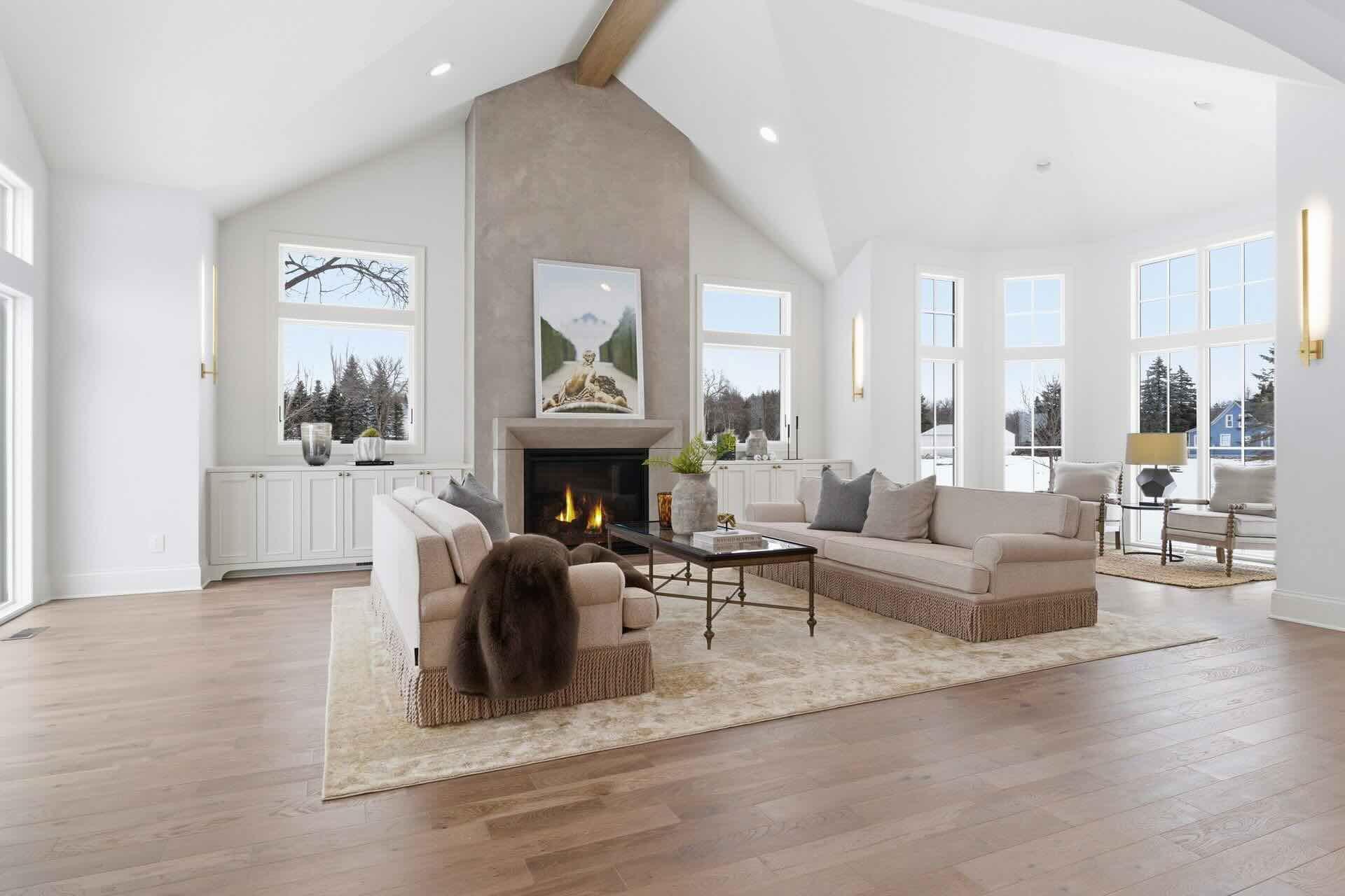 Vaulted ceilings highlighted by a striking wood beam create an airy, light-filled space..