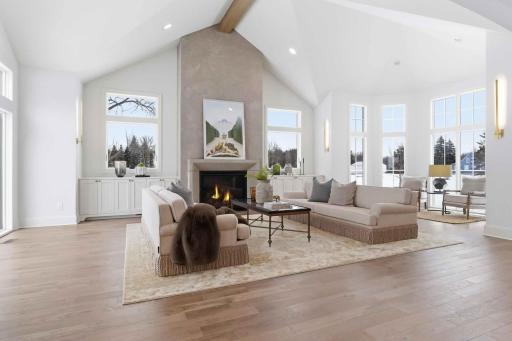 Vaulted ceilings highlighted by a striking wood beam create an airy, light-filled space..