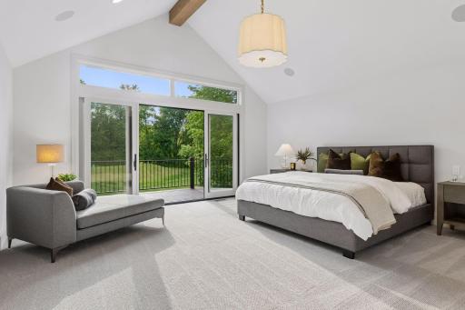 Primary suite with vaulted ceilings, walk out to deck and incredible views.