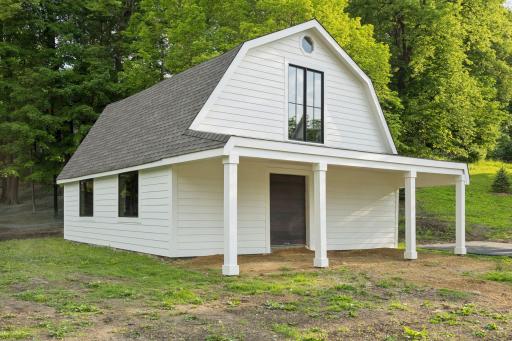 Two versatile outbuildings: This barn (28x36 with 18x36 loft) complete with new concrete floor, new marvin windows, new entry doors, new roof, soffit, and siding.
