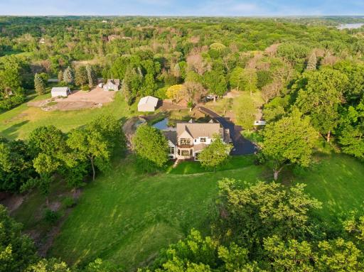 Tucked 400 feet off the road behind a peaceful pond and fountain.