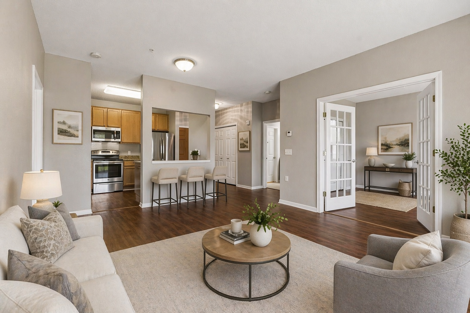 Virtually staged living room with an open-concept layout, seamlessly connecting to the office and kitchen.