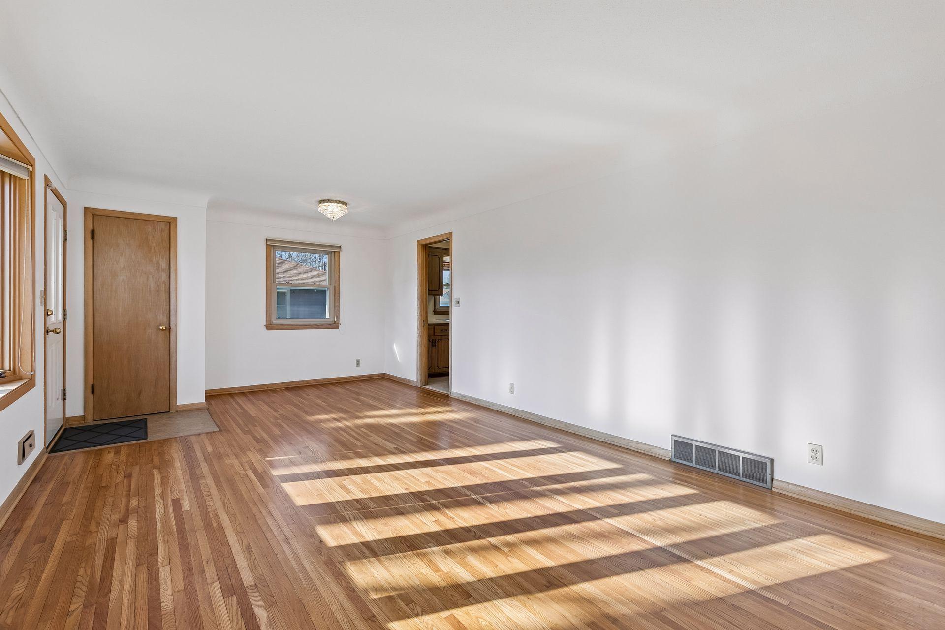 Another perspective highlighting the generous living area, ideal for entertaining with seamless flow to the kitchen.