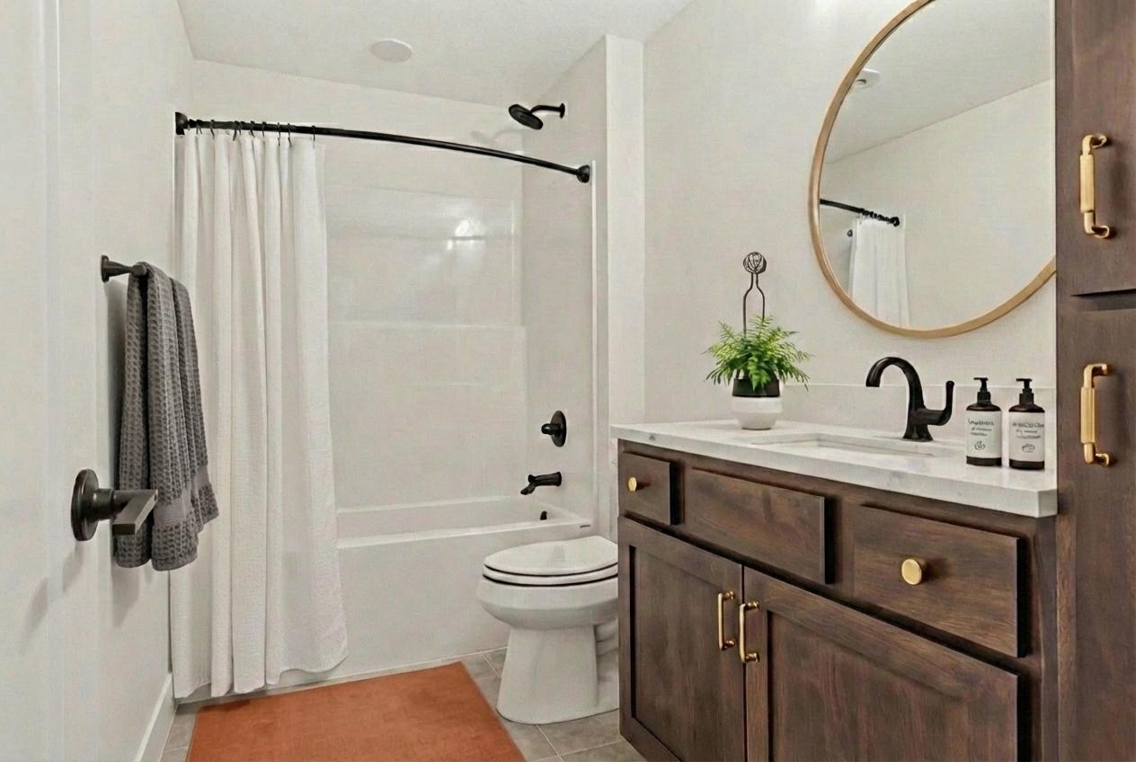 Lower level bathroom. *Photos are from a prior model-Majority of shown options are included in the sales price. Virtually staged to show design options.