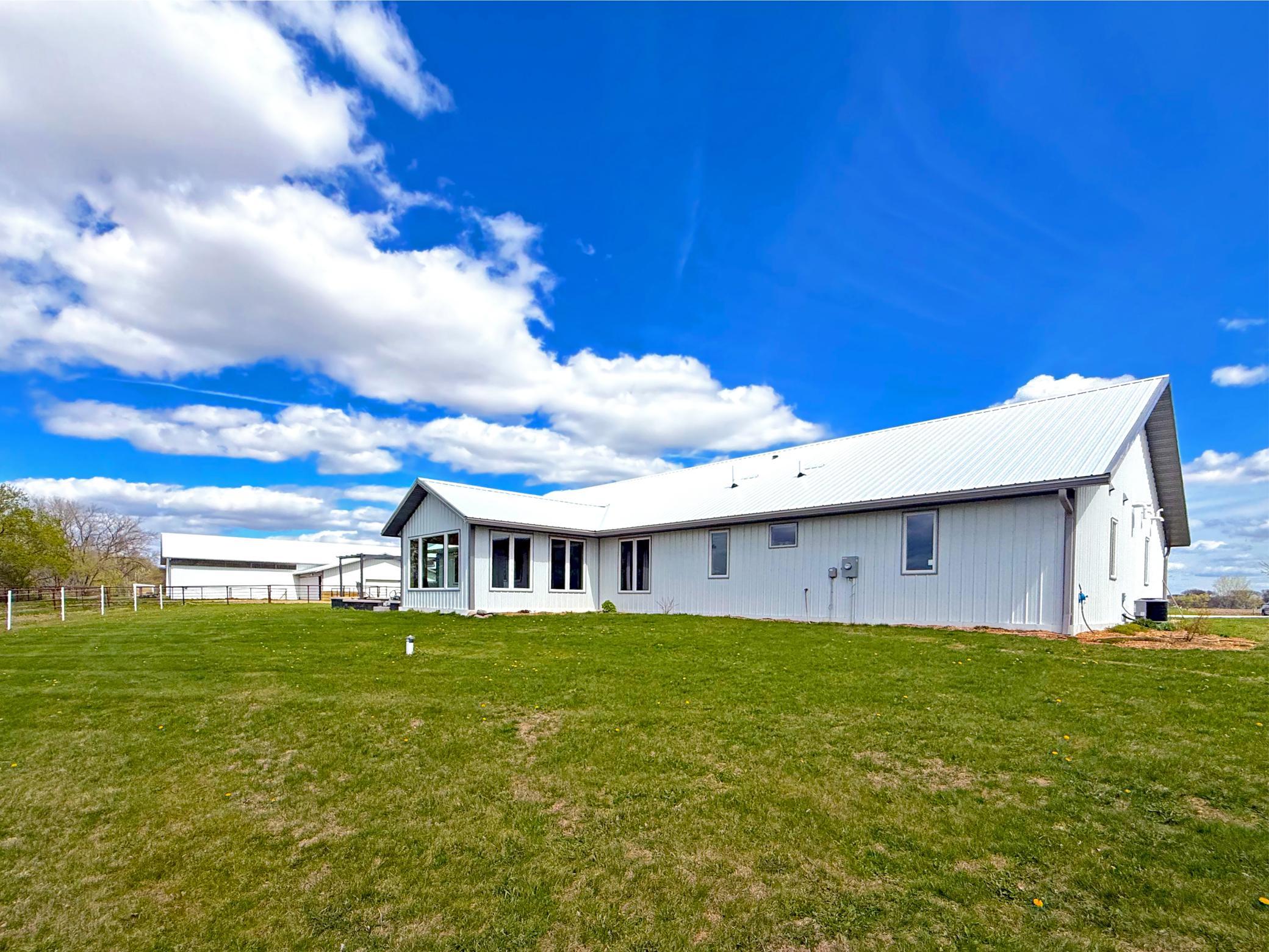 Experience the perfect blend of country living and modern convenience with this beautifully designed shouse-style home.