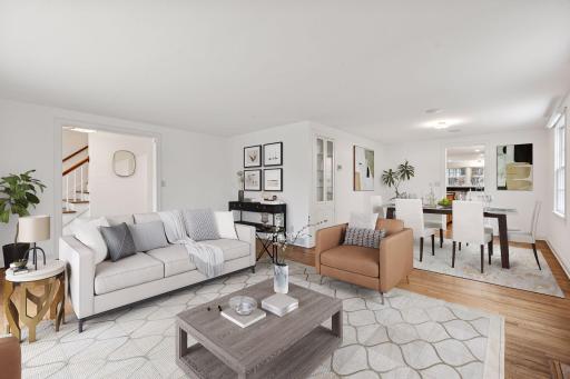 This exquisite room exudes elegance and warmth, featuring expansive windows that flood the space with natural light.