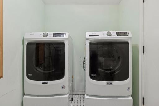 Upper level laundry room and linen closet