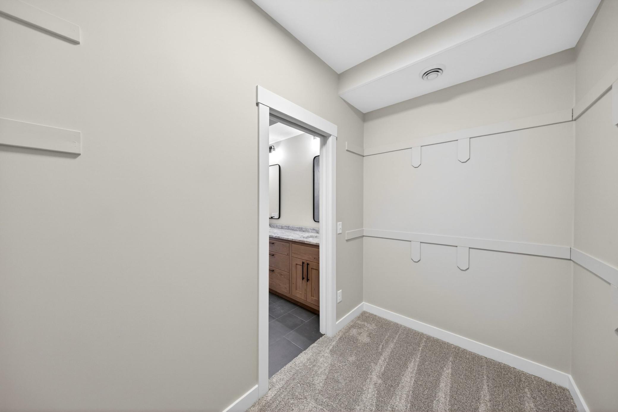 023 - Main Floor Primary Walk in Closet.jpg