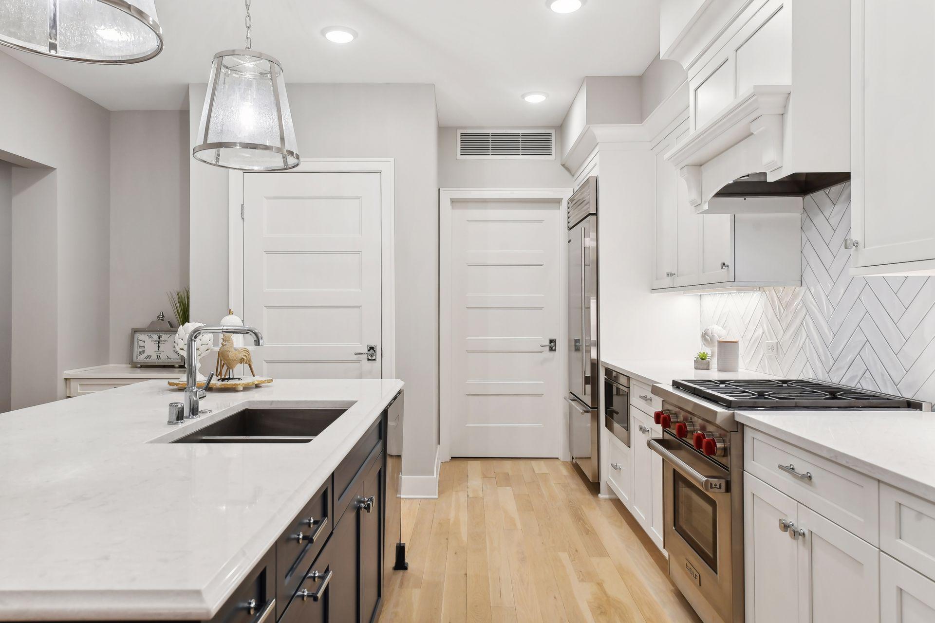 Spacious walk-in pantry and laundry room seamlessly connected to the kitchen