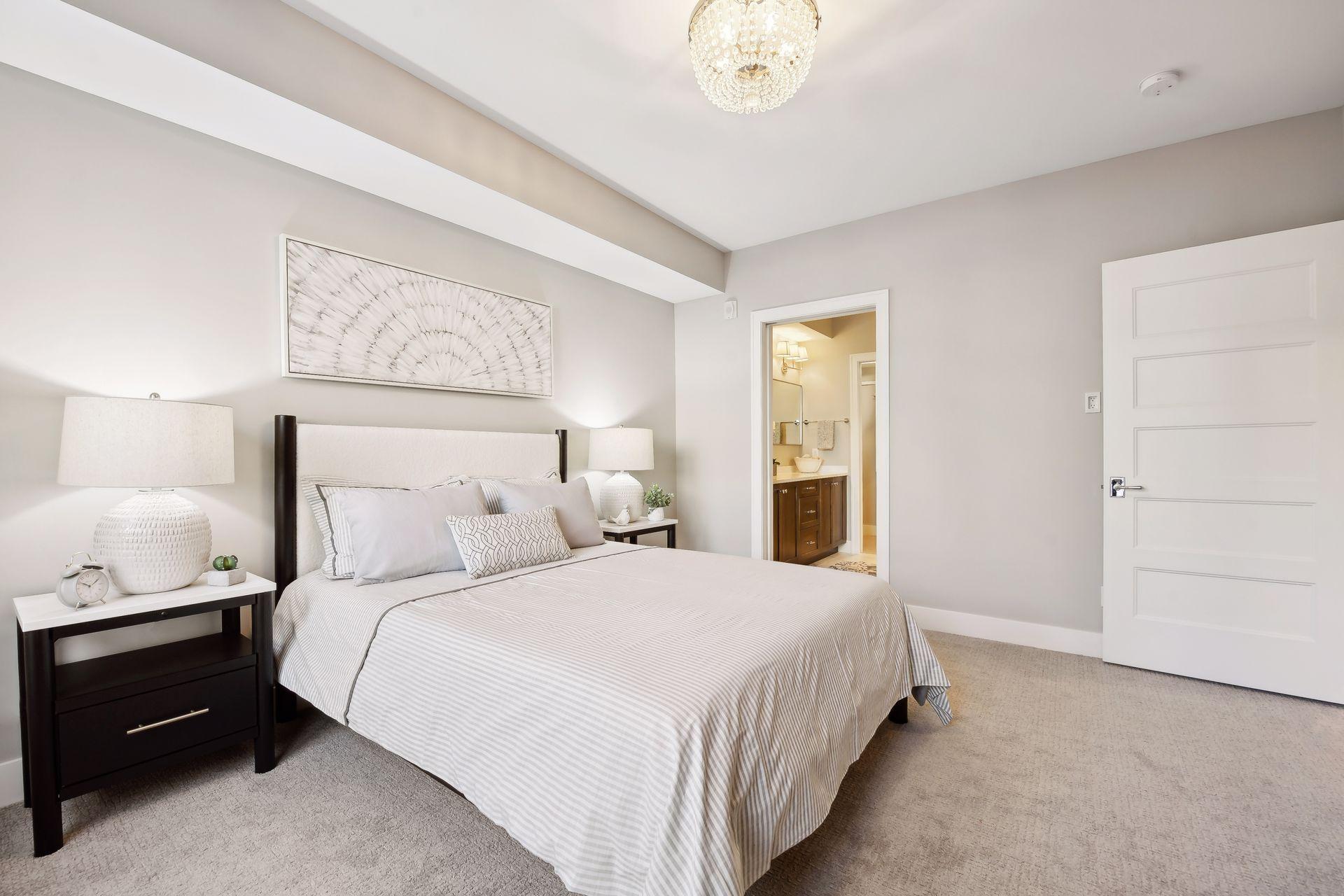 Retreat to the sunlit primary bedroom, complete with an en suite bathroom