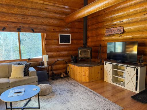 Enjoy peaceful mornings with natural sunlight and a cup of coffee in front of the woodstove.