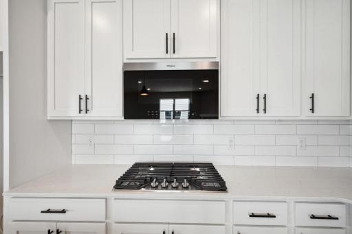 It's in the details - microwave fan is vented to the exterior. Spec home, colors and finishes will vary.