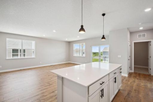 Easily remain a part of the action, even if you are the chef in the kitchen! Spec home, colors and finishes will vary.