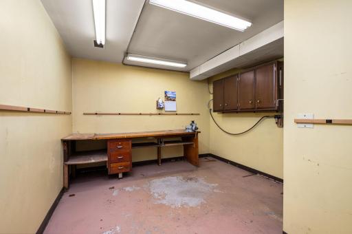 Dedicated workshop area connected to the insulated garage, equipped with a 220 sub-panel - ideal for welders or electric vehicle charging!