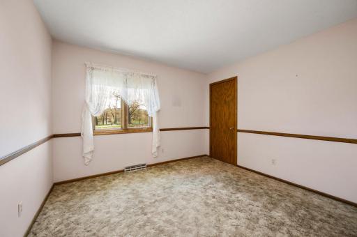 Primary bedroom with walk-in closet and walk-through full bathroom