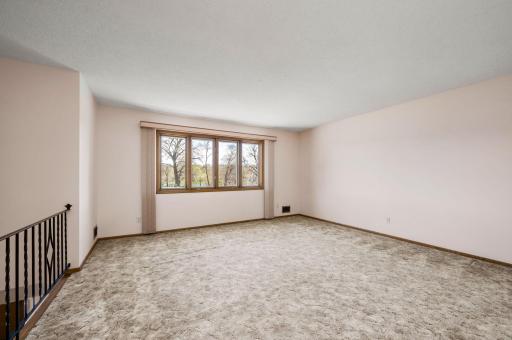 Enjoy private park views through the large living room windows, radiating the home with natural light from its desirable southwest exposure