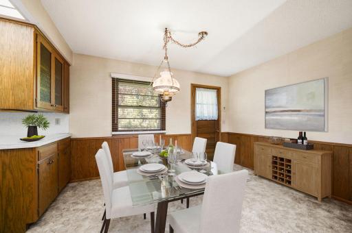 Dining area which offers direct access to a flat, private backyardâperfect for entertaining!