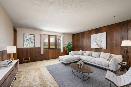 Finished walkout Lower Level includes a nice covered front deck overlooking the park, a second large living area with an additional view and a half-bath, Practical Workspace, a dedicated workshop area connected to the insulated garage, equipped with