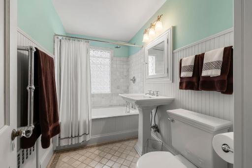 Beautifully updated second floor bath with heated floor and towel bar