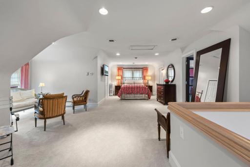 The elegant primary suite spans the third floor
