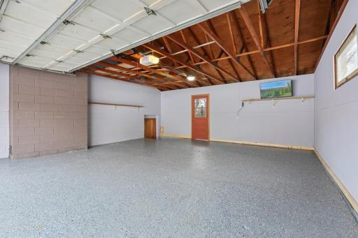 Attached garage with painted and sealed floor, TV included
