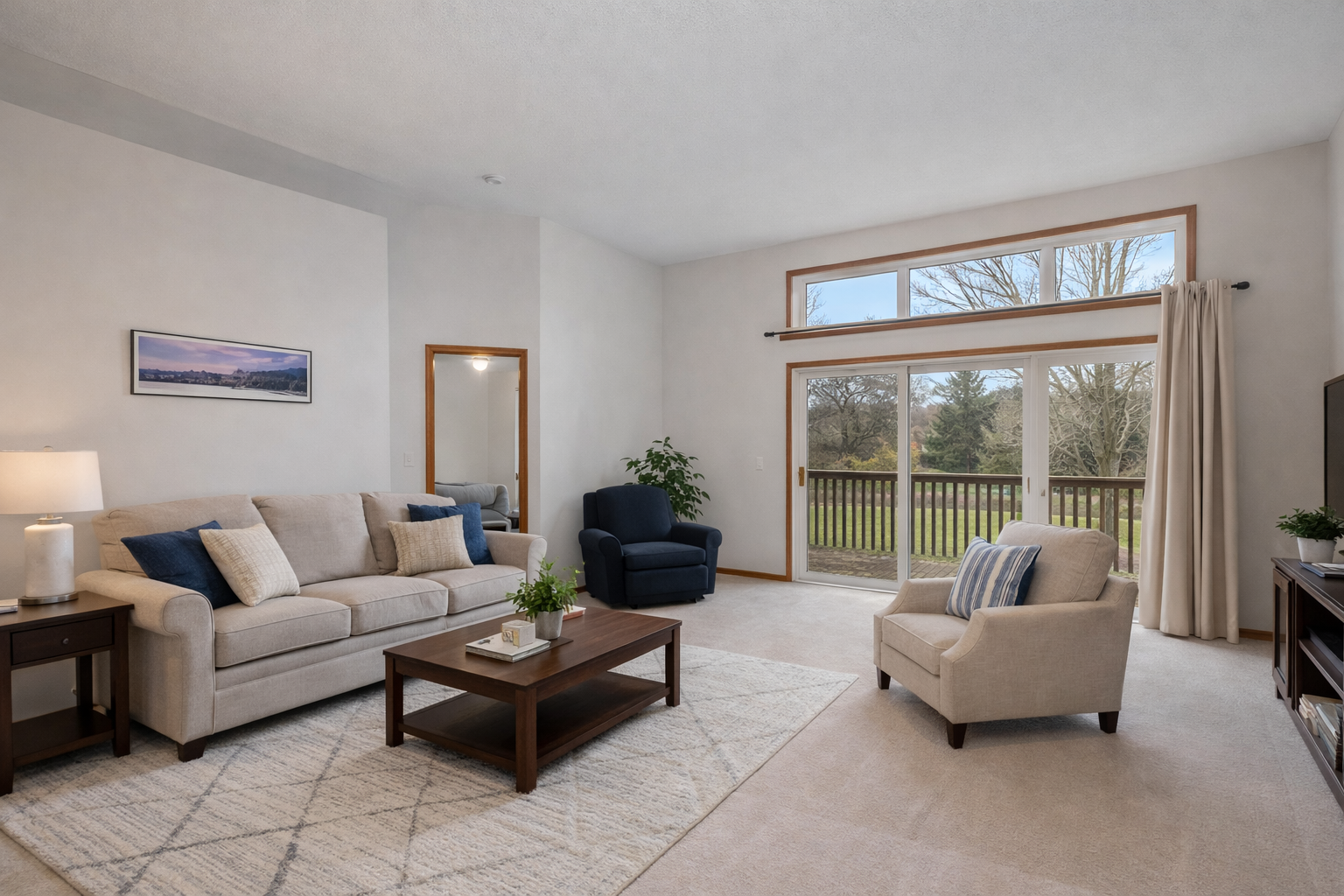 The living room could have many different options for your furniture layout. This is an enhanced photo for you to imagine.