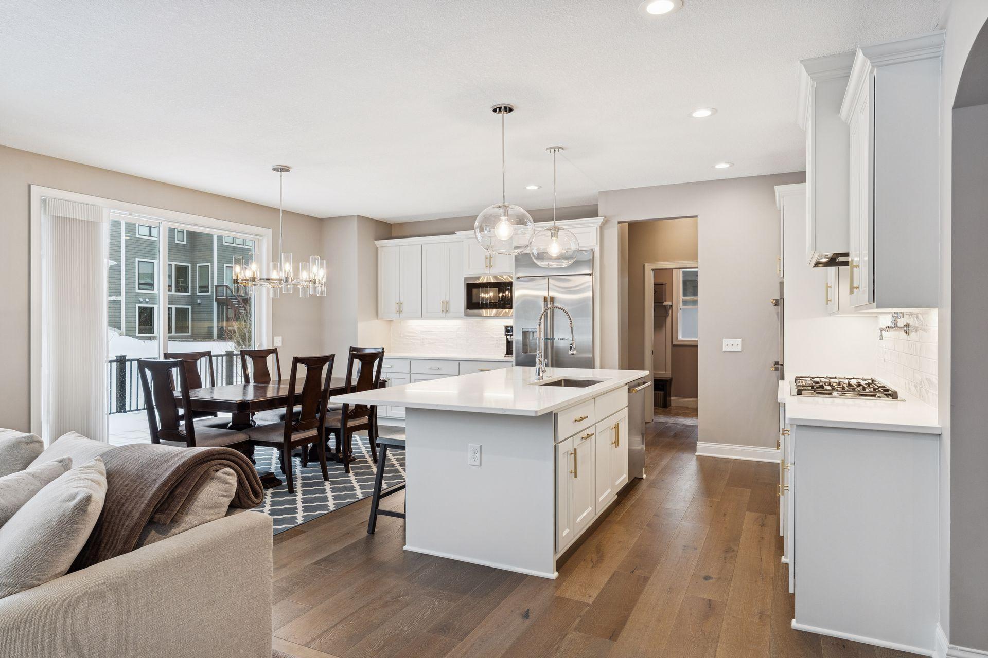 Open kitchen with hardwood floors and walk-in pantry.