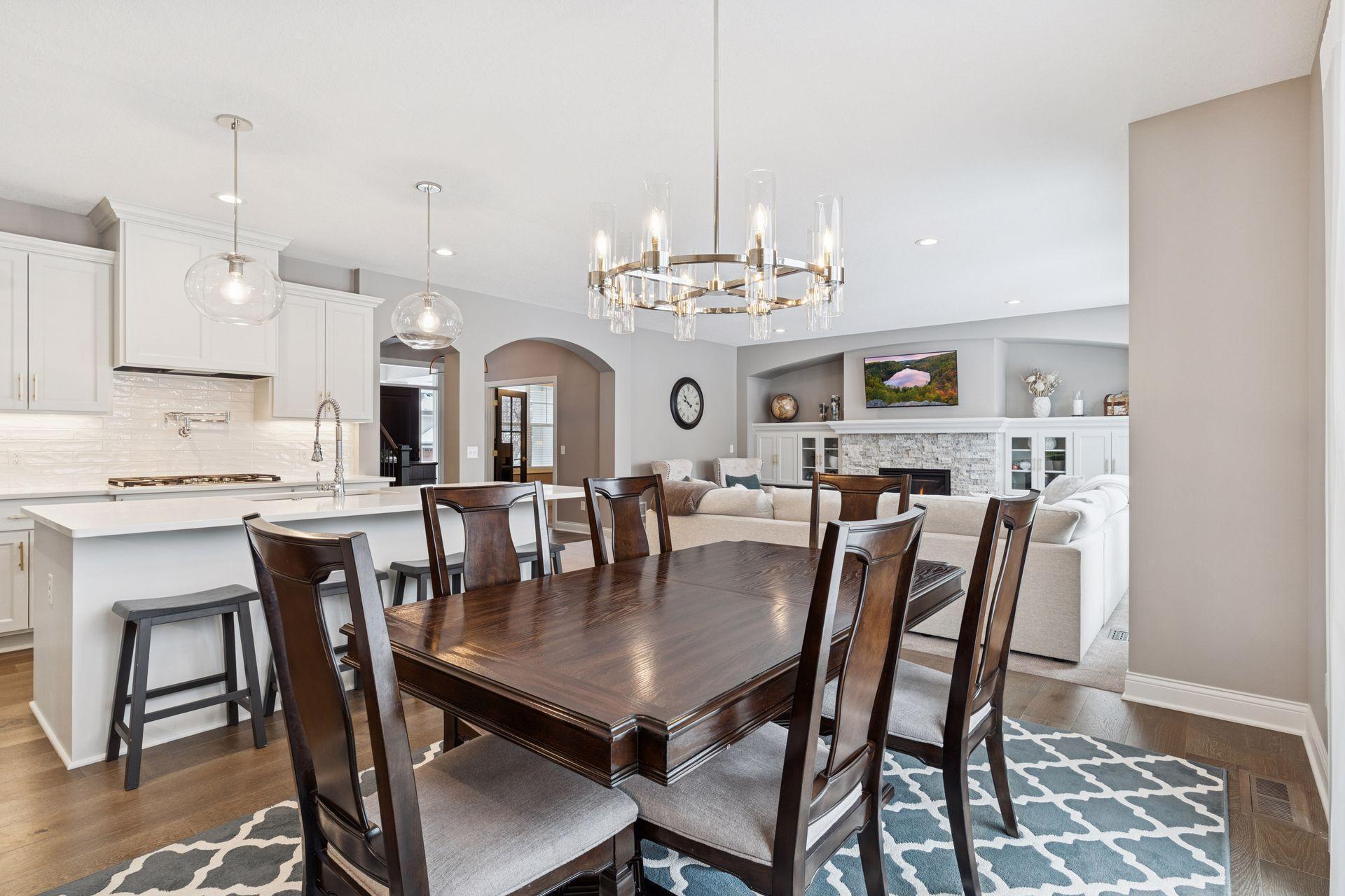 Open great room with large eating area with patio doors to deck and yard.