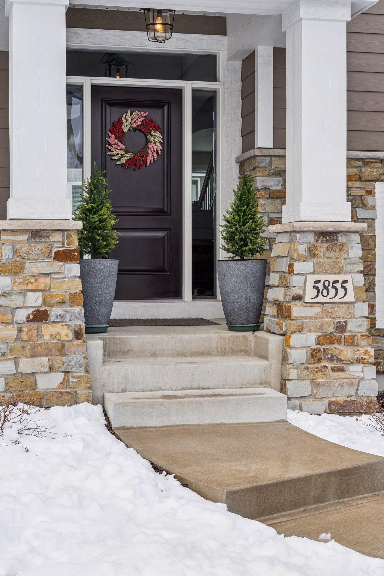 The stone entryway and covered front porch!