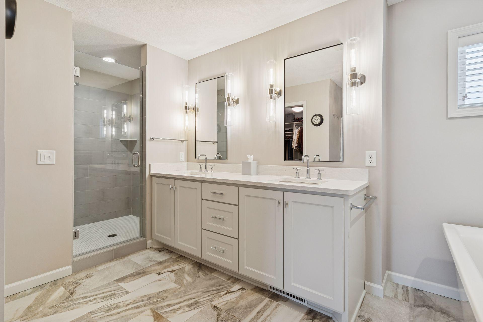 Double vanity with walk-in shower in Primary Suite