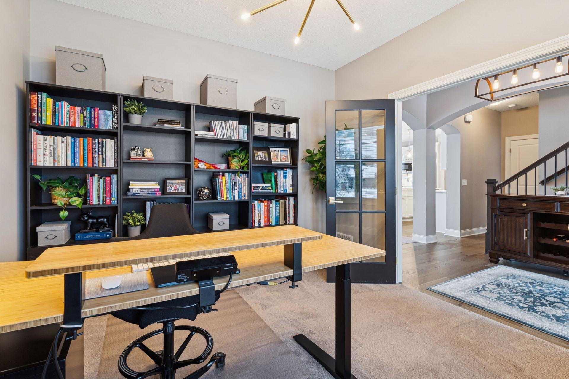 Main floor home office with french doors for privacy!