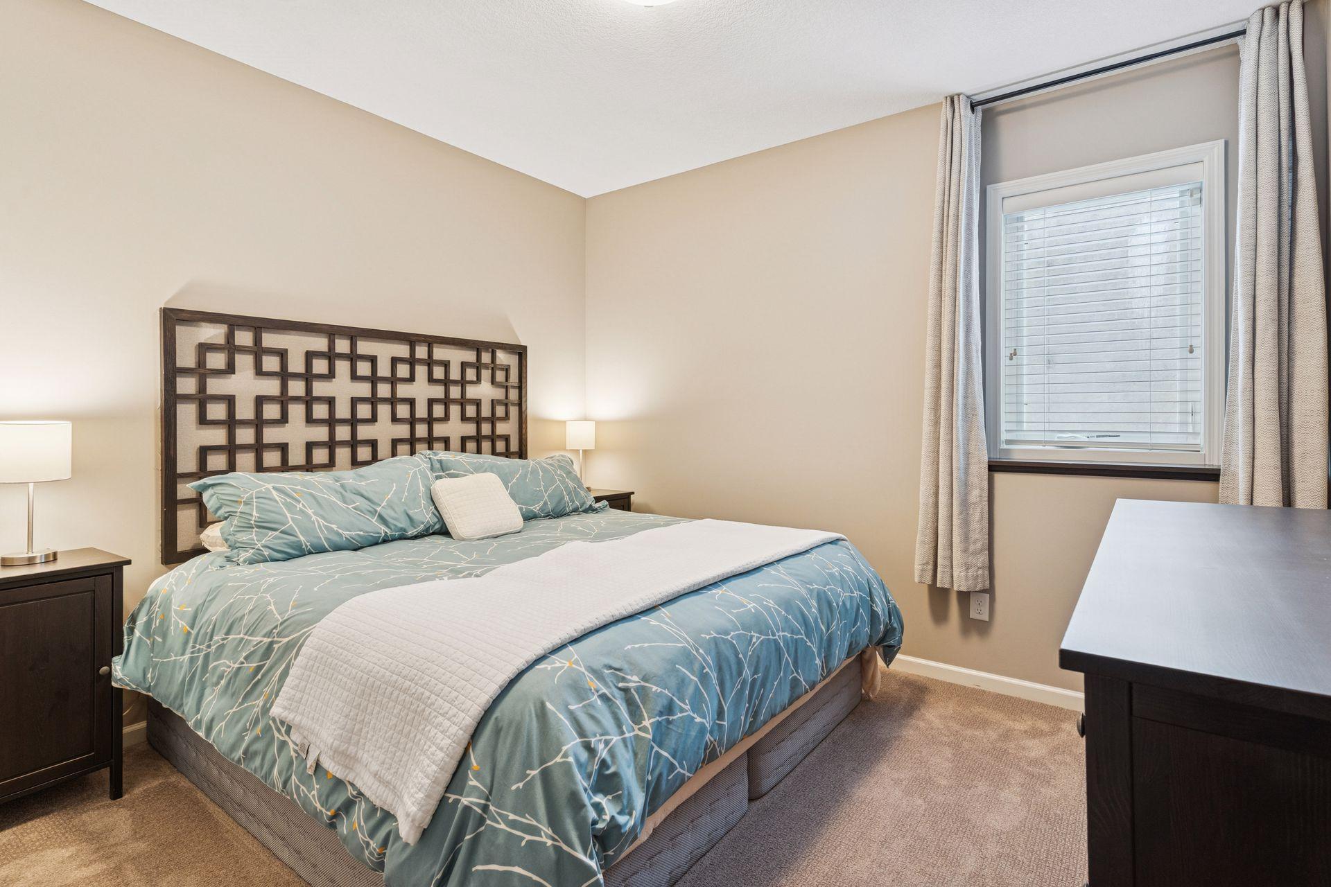 5th bedroom in the lower level with adjacent 3/4 bath