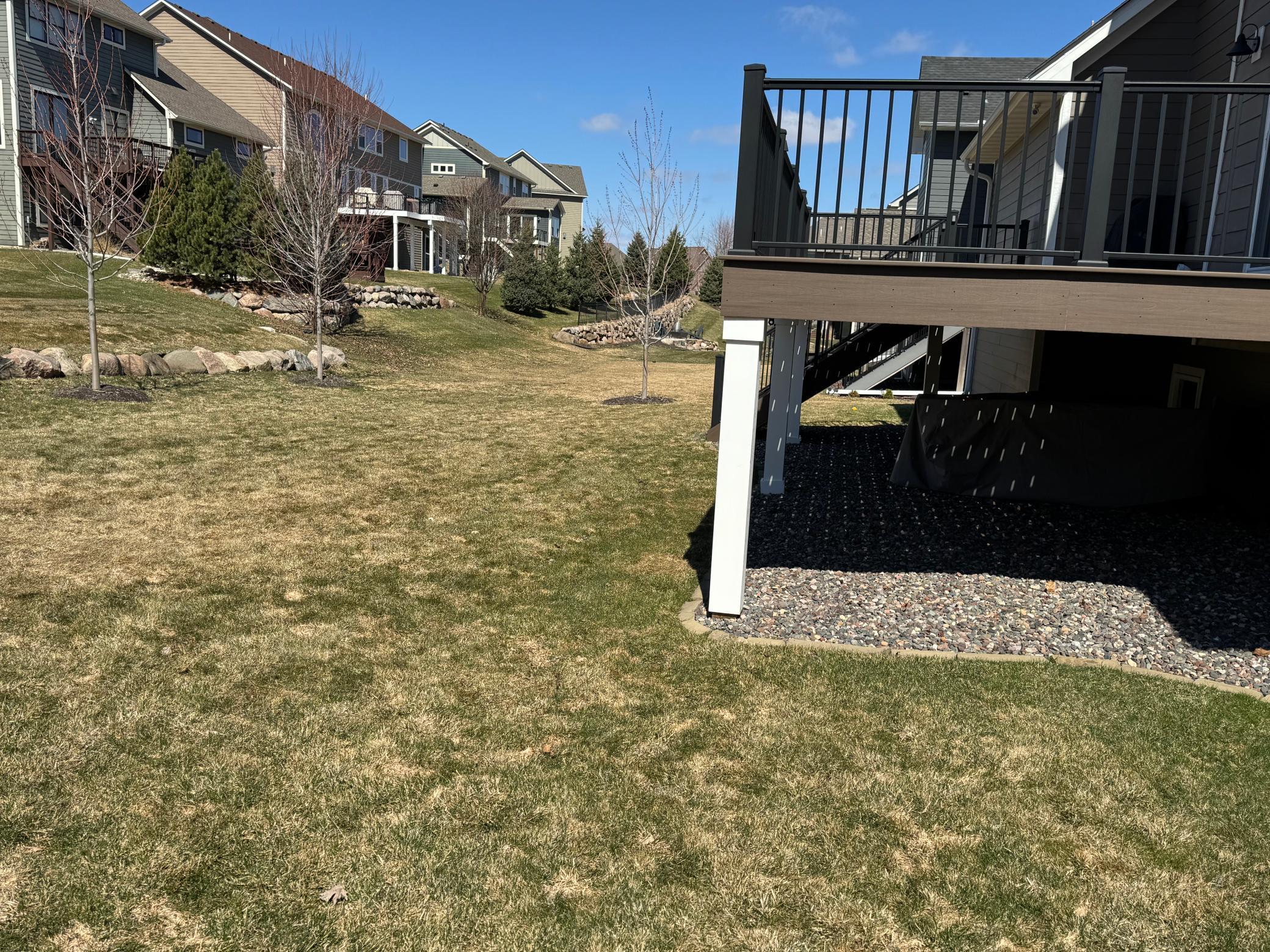 Maintenance free deck with stairs to flat yard.