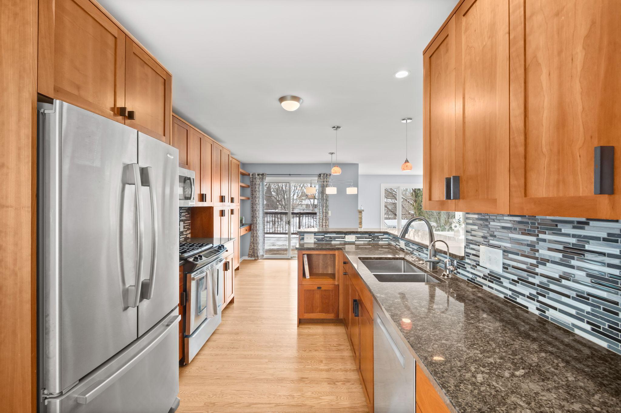 This kitchen was remodeled with functionality in mind. Beautiful cherry cabinetry, tons of counterspace and pull-out drawer cabinets for your convenience.