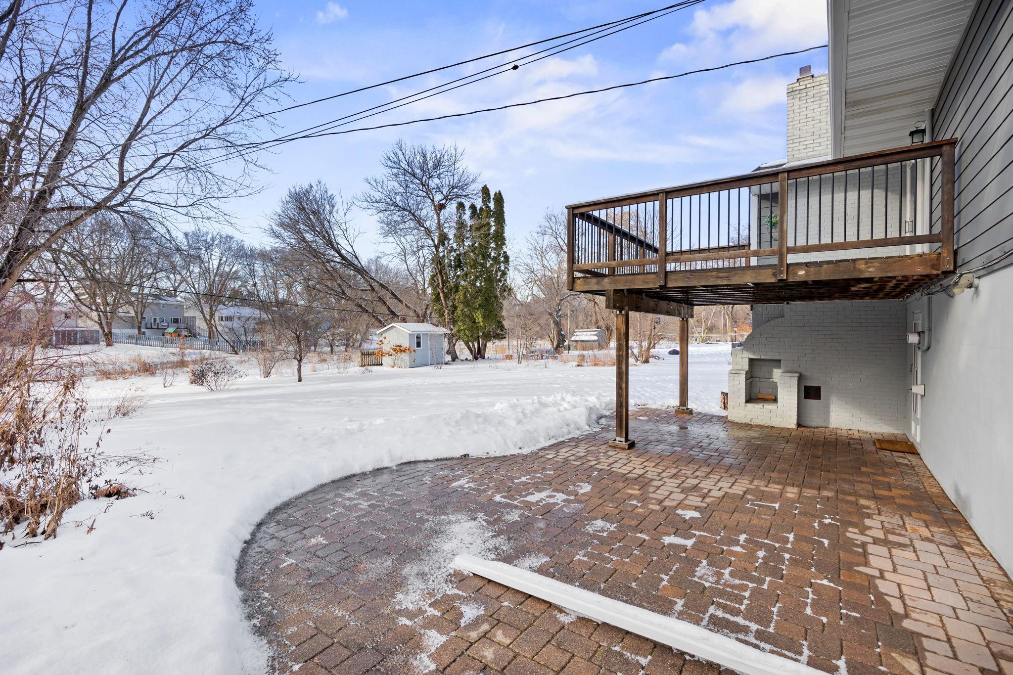 Large paver patio and look at this gorgeous flat backyard.