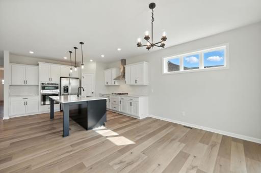 Fabulous show stopping floorplan, landscaping included. Community pool, clubhouse, miles of walking trails, parks, & Mississippi River down the street! This is a rare gem! Fall in love & call it HOME!!10+