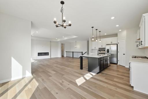 Fabulous show stopping floorplan, backs up to trees & pond! Sod, landscaping included. Community pool, clubhouse, miles of walking trails, parks, & Mississippi River down the street! This is a rare gem! Fall in love & call it HOME!!10+
