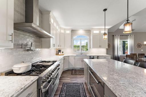 Newly updated kitchen with stone counters, tile backsplash and high appliances with plenty of natural light!