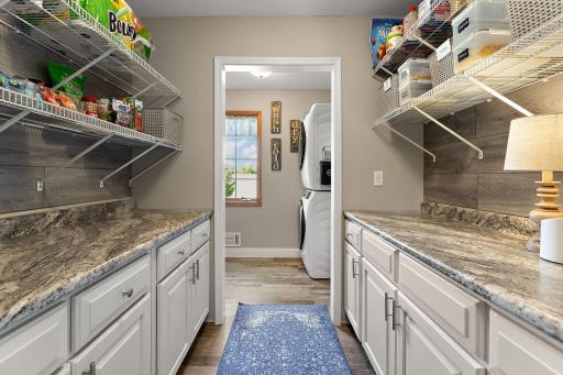 updated laundry room with ample space for storage!