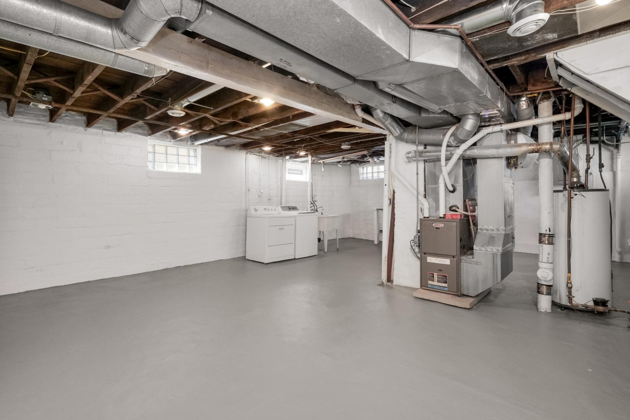 Unfinished basement with glass block windows.